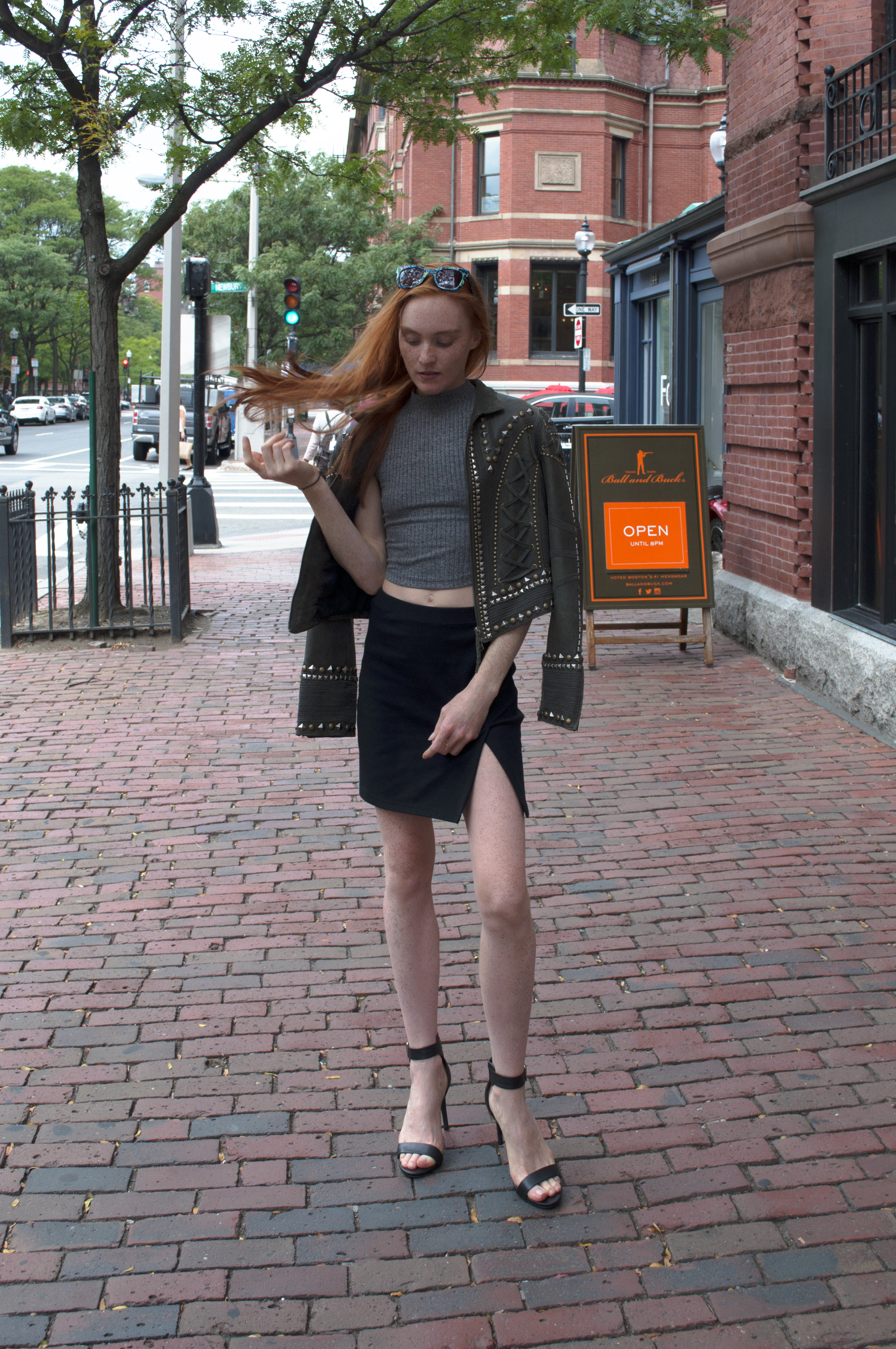 fashion blogger wearing studded leather jacket on Newbury Street Boston