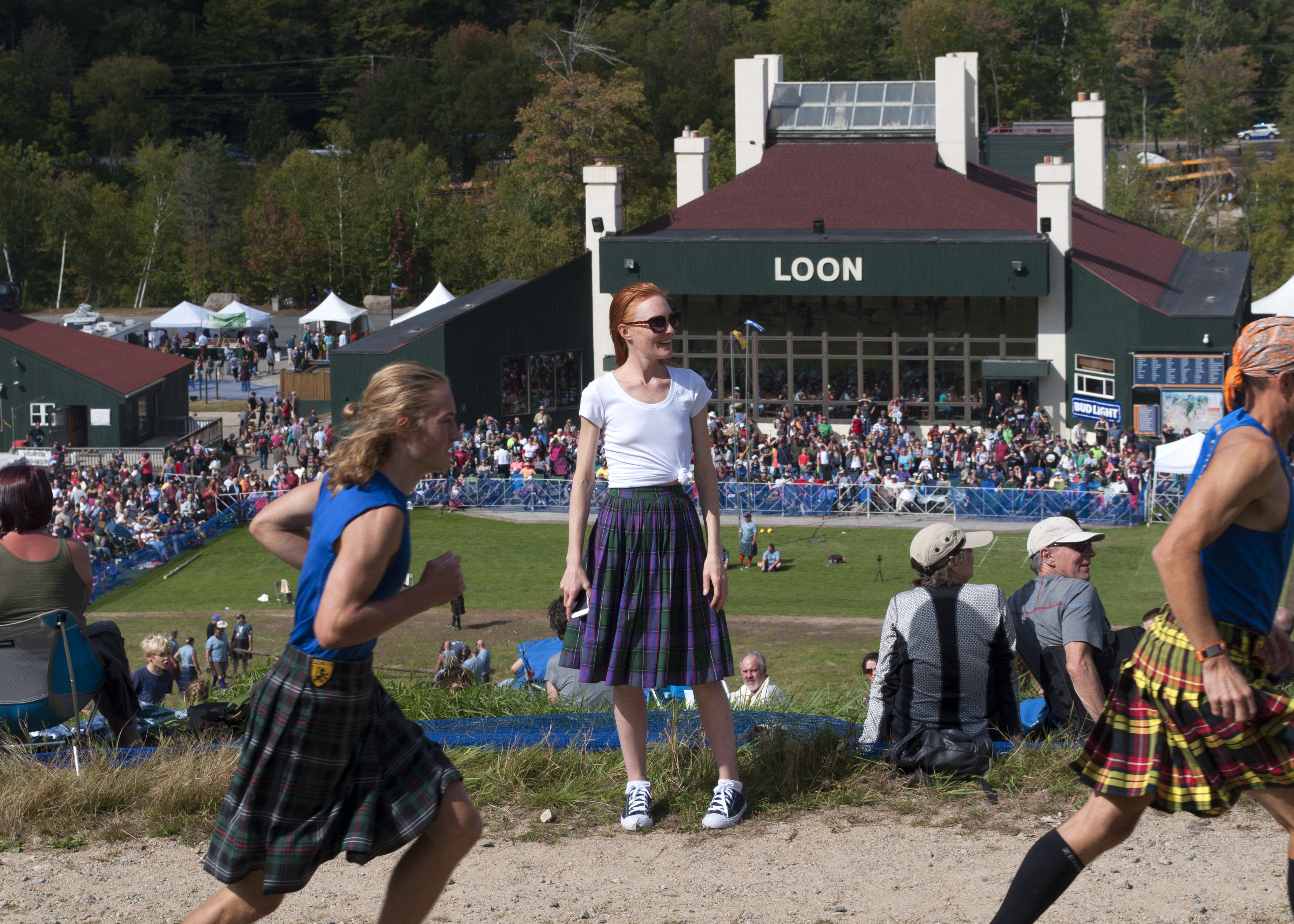 fashion blogger at highland games wearing tartan skirt and converse sneakers loon mountain