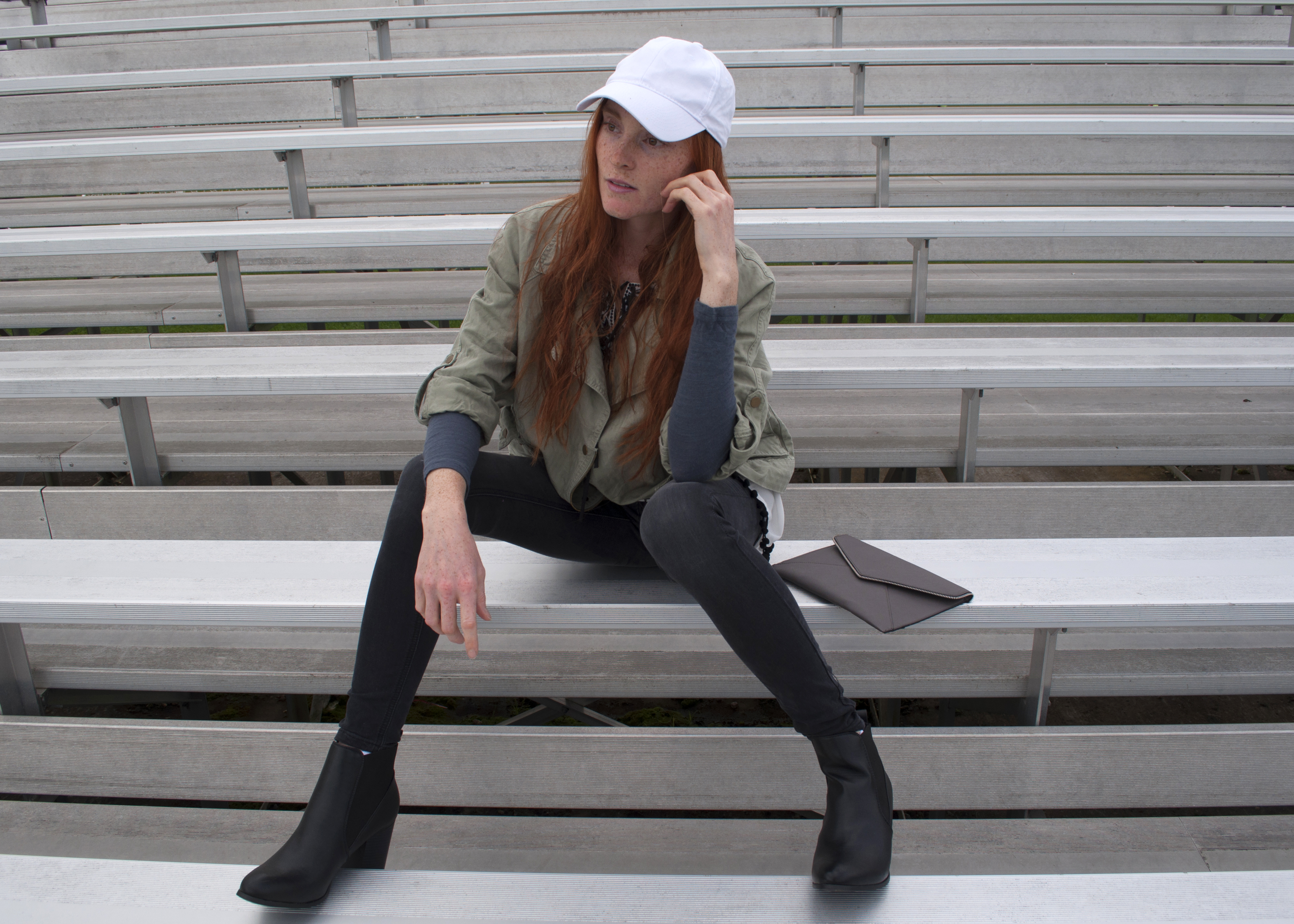 fashion blogger in skinny jeans cargo jacket lace and booties