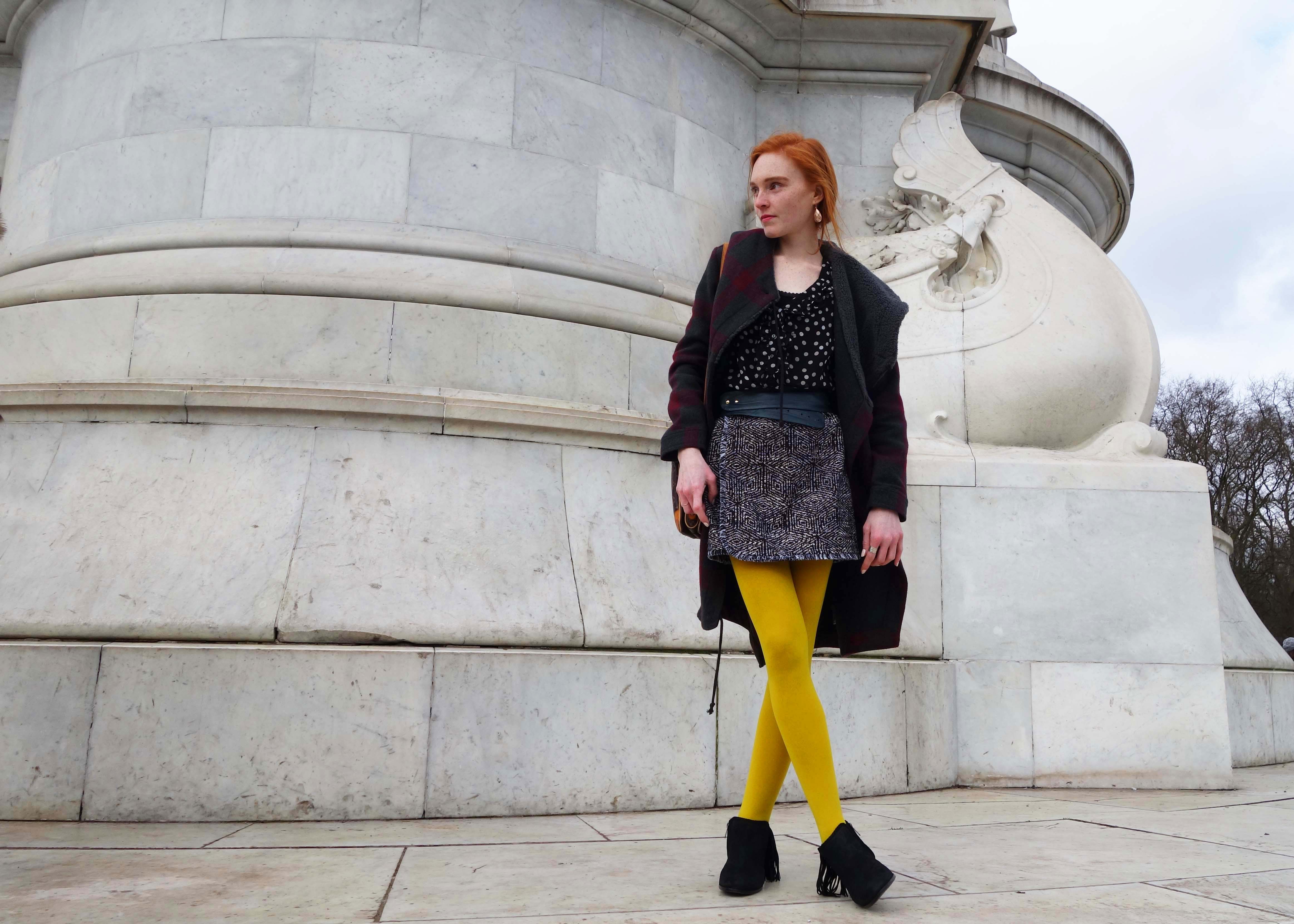 mixed prints and yellow tights at London Fashion Week