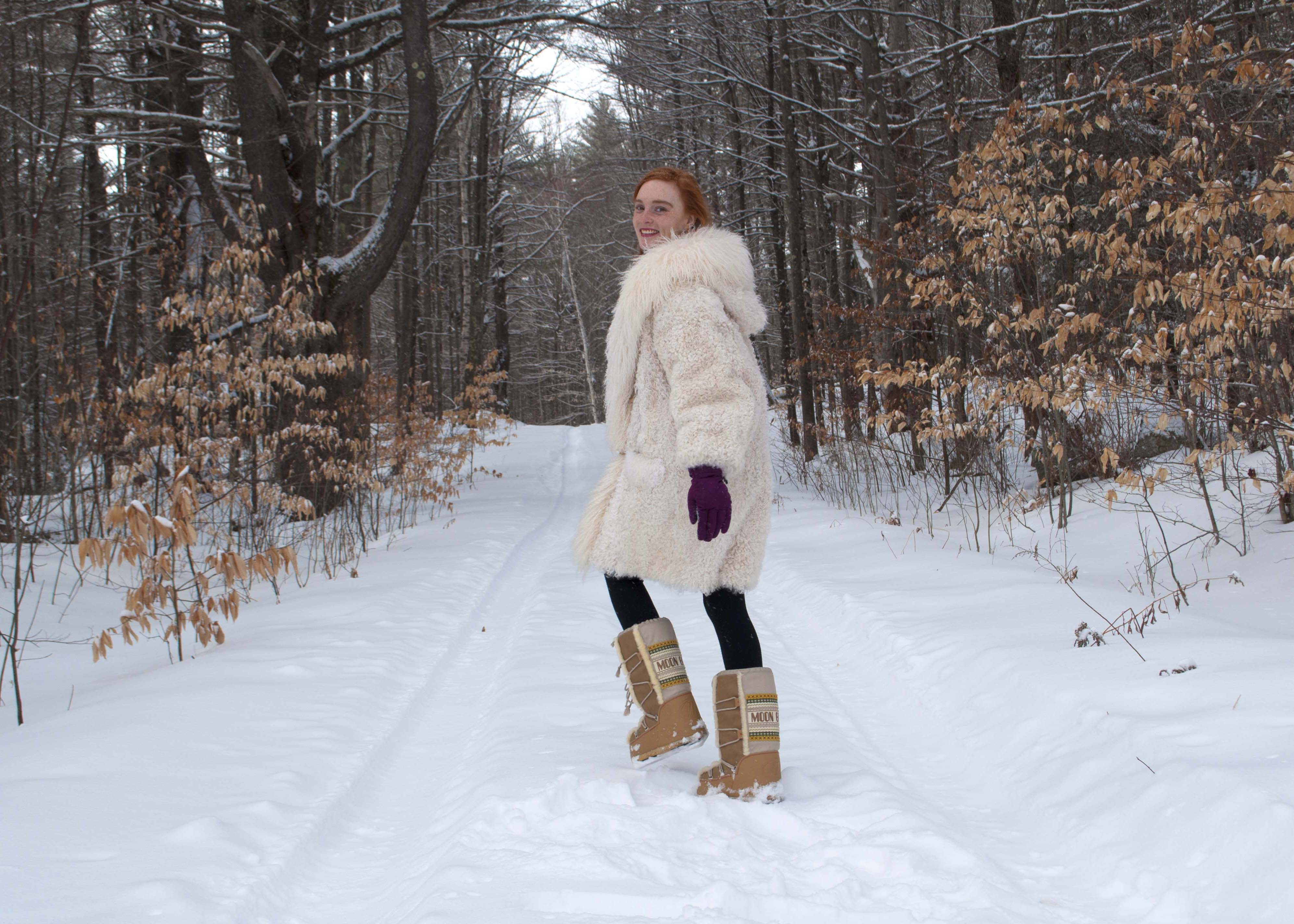 fashion blogger wearing moon boots for winter 