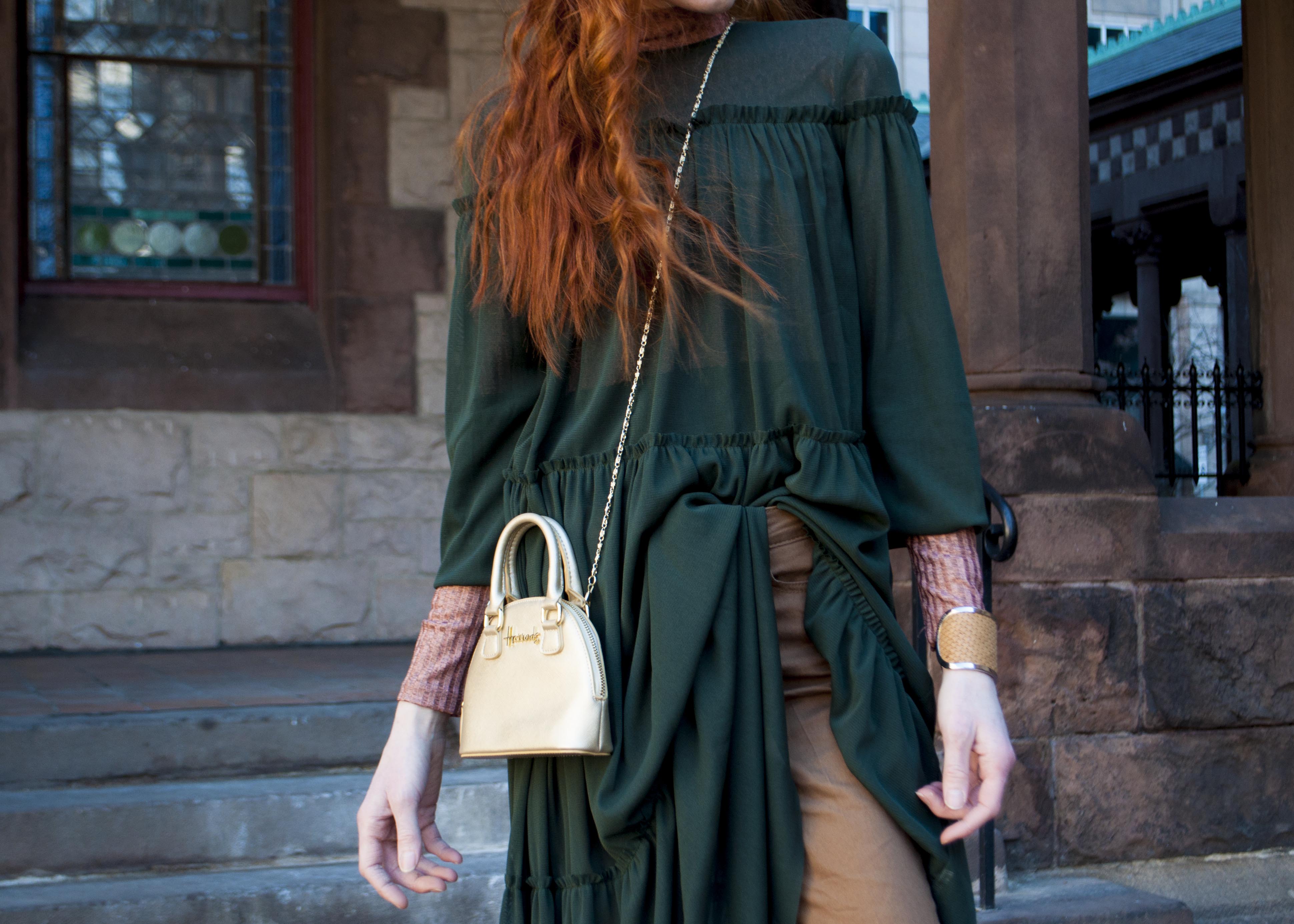 green tulle dress layered over pants