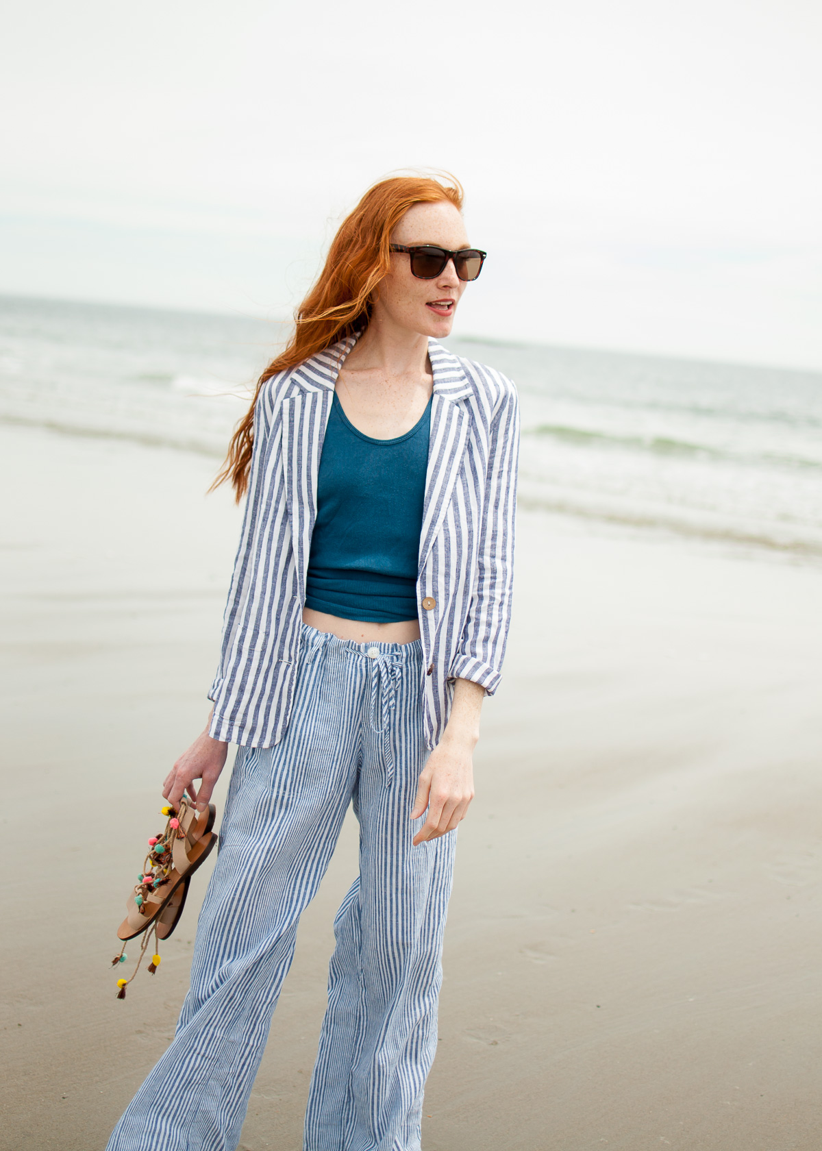 wearing effortless linen pieces summer style on the beach 