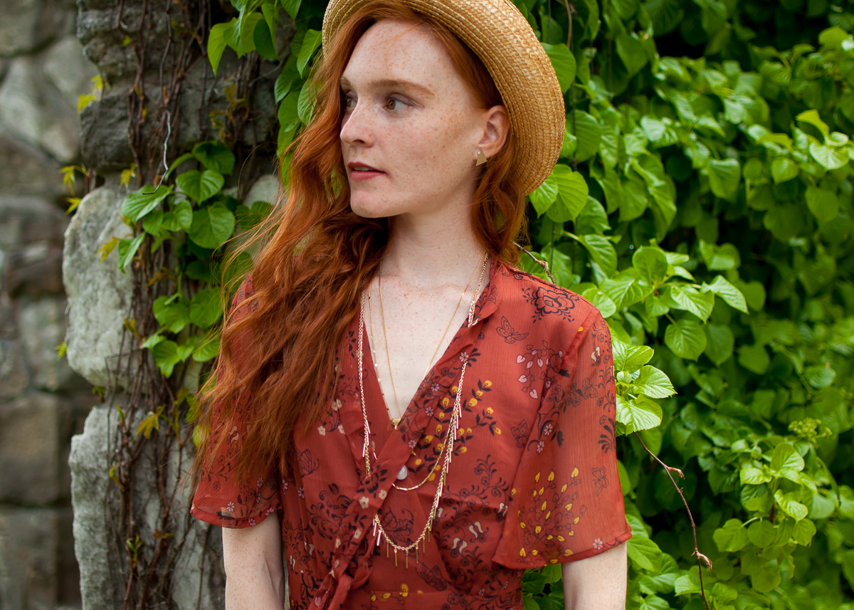 One Clothing dress with vintage hat and gold necklaces on blogger Mary O'Neill