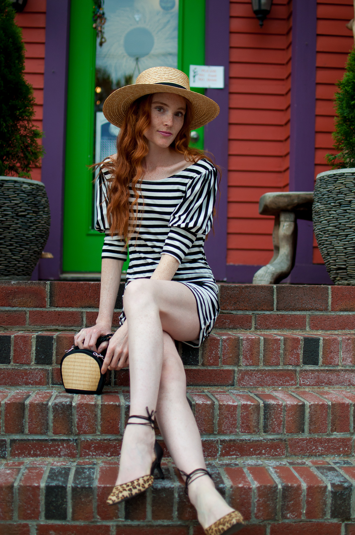 Summer dress and straw boater hat while traveling in New England 