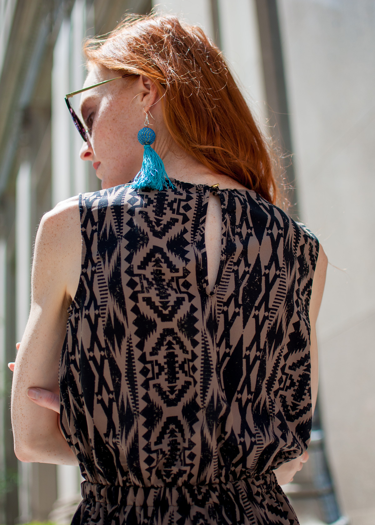 printed silk jumpsuits with handmade tassel earrings