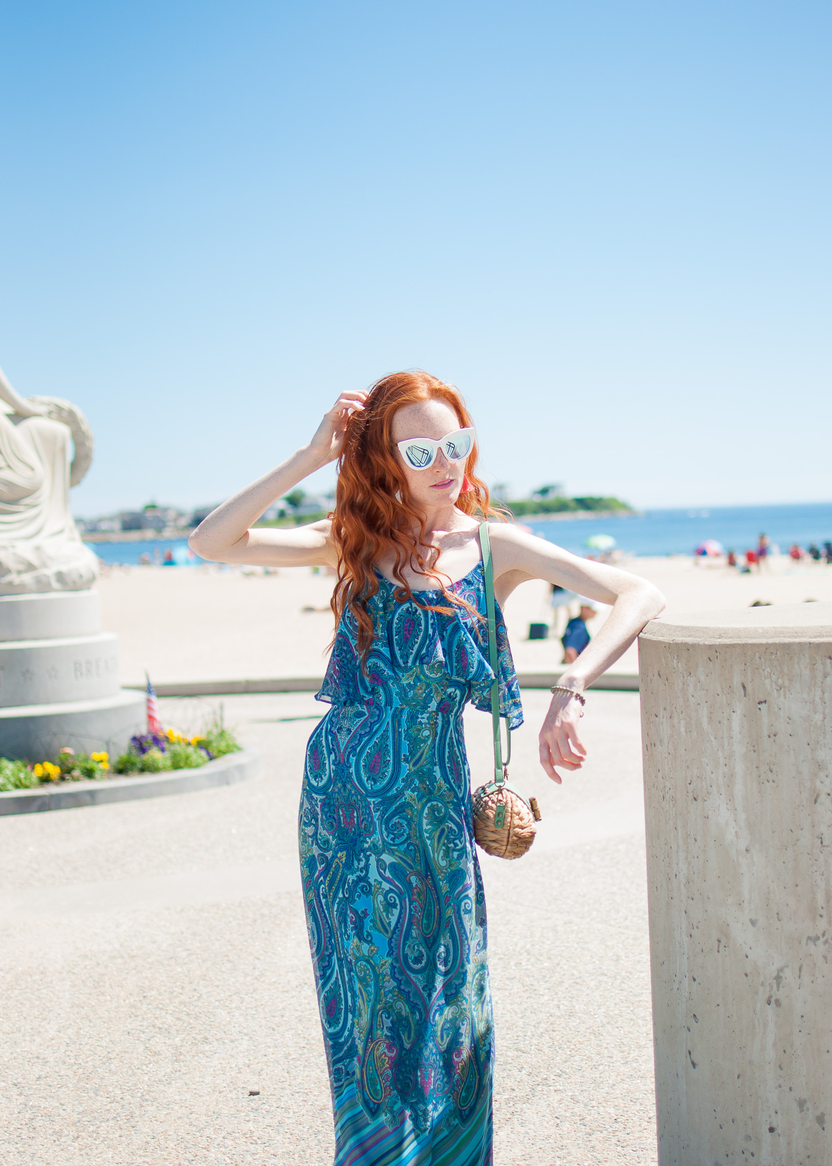 Sandra Darren paisley print maxi dress with Sun N' Sand clutch and Quay Australia sunglasses at Hampton Beach