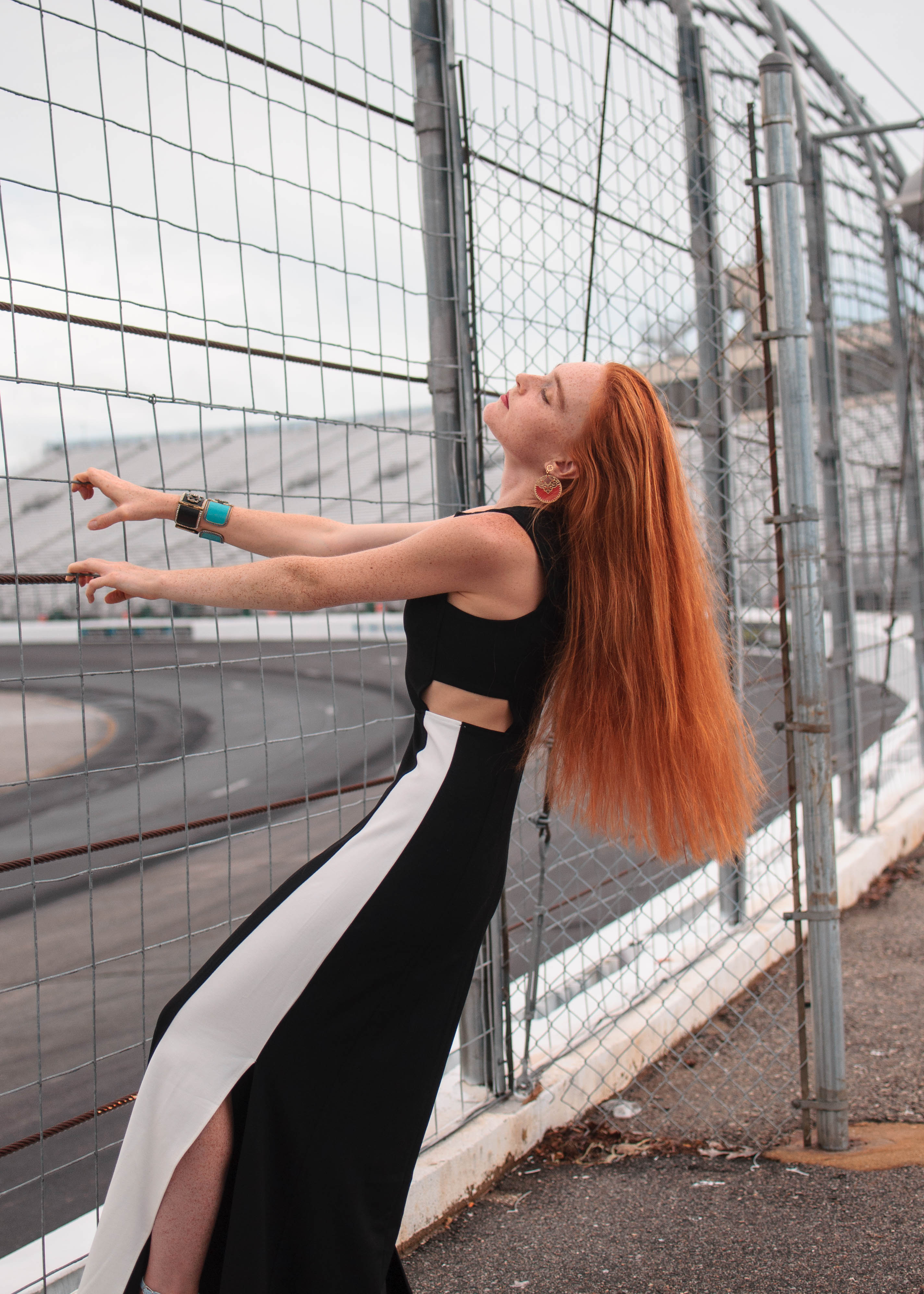 fashion blogger wearing black and white at New Hampshire motor speedway